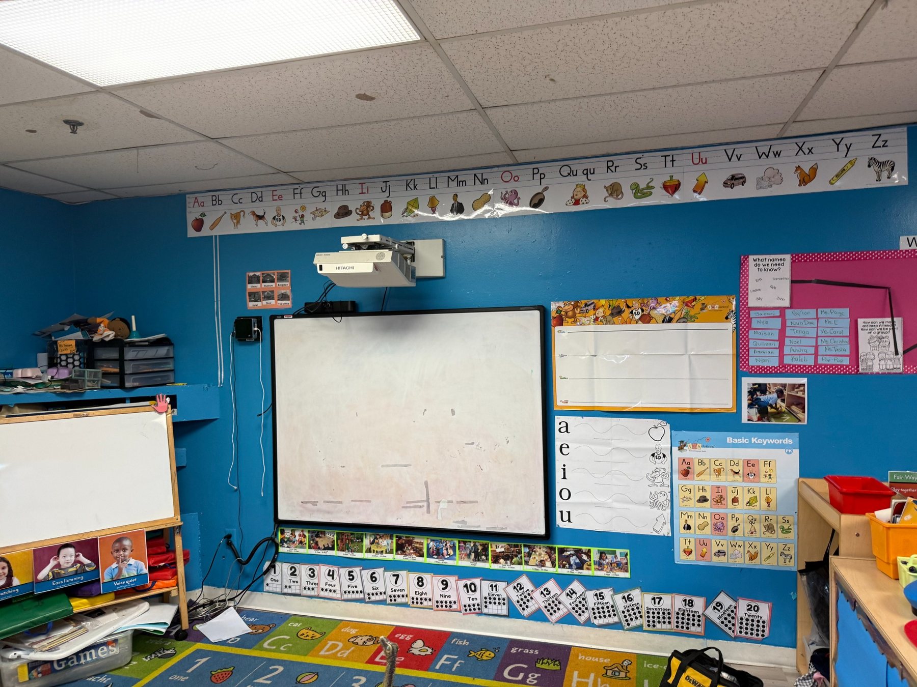 Page Academy classroom before the upgrade with an older projector and interactive whiteboard system